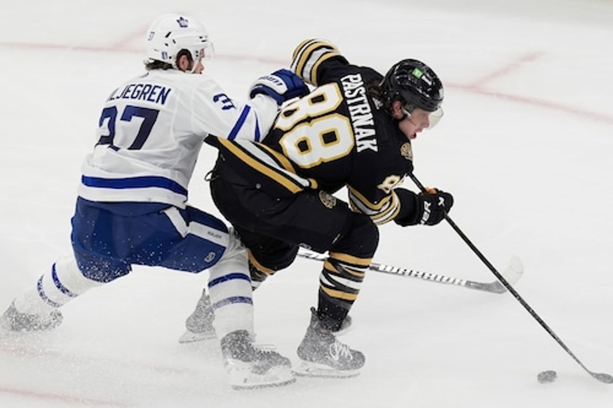 # Title: Marchand Leads Bruins to Victory Over Maple Leafs in Game 3 Showdown